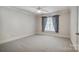 Clean, empty bedroom with gray walls, carpeted floors and a large window at 928 Thorn Ridge Ln, Clover, SC 29710