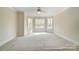 Bright bedroom features a bay window with a lake view and neutral carpet at 928 Thorn Ridge Ln, Clover, SC 29710