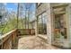 A wooden deck features a railing and a view of the surrounding trees and windows of the house at 928 Thorn Ridge Ln, Clover, SC 29710