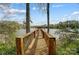 Wooden walkway leads to a private dock on a calm lake, surrounded by trees at 928 Thorn Ridge Ln, Clover, SC 29710