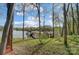 The tranquil lakefront property features a private dock for boating and enjoying the water at 928 Thorn Ridge Ln, Clover, SC 29710