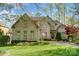 Charming brick home with manicured lawn, mature trees, and inviting curb appeal at 928 Thorn Ridge Ln, Clover, SC 29710