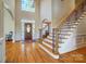 Grand foyer with hardwood floors, a staircase with iron spindles, and a large window at 928 Thorn Ridge Ln, Clover, SC 29710