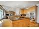 Open kitchen with island, stainless steel appliances, granite countertops, and views to the living area at 928 Thorn Ridge Ln, Clover, SC 29710