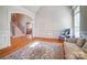 Elegant living room features hardwood floors, wainscoting, and an arched doorway leading to the staircase at 928 Thorn Ridge Ln, Clover, SC 29710