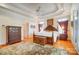 Bright main bedroom with a tray ceiling, hardwood floors and a decorative rug at 928 Thorn Ridge Ln, Clover, SC 29710