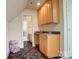 Stylish wet bar features a sink, granite countertop, and tiled floors at 928 Thorn Ridge Ln, Clover, SC 29710