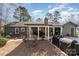 A well-maintained backyard featuring a covered patio, perfect for outdoor relaxation and entertaining at 9401 Elvis Dr, Charlotte, NC 28215