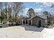 Exterior view of a home with a covered porch, outdoor grill and storage shed at 9401 Elvis Dr, Charlotte, NC 28215