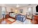 Comfortable bedroom with a ceiling fan, hardwood floors, and curtains at 9401 Elvis Dr, Charlotte, NC 28215