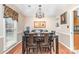 Formal dining room with a dark wood table and chairs under an elegant chandelier at 9401 Elvis Dr, Charlotte, NC 28215