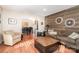Comfortable living room showcasing stylish decor, hardwood floors, and a dining area view at 9401 Elvis Dr, Charlotte, NC 28215