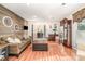 Inviting living room featuring wood accent wall, sofa, and view of the home's entryway at 9401 Elvis Dr, Charlotte, NC 28215