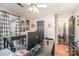 Office features dark wood floors, multiple windows, dark desk and furnishings, and ceiling fan at 9401 Elvis Dr, Charlotte, NC 28215