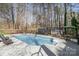 Backyard with a fenced in pool, patio, chairs, umbrella and storage sheds at 9401 Elvis Dr, Charlotte, NC 28215