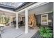 Covered porch featuring outdoor furniture and a brick fireplace at 9401 Elvis Dr, Charlotte, NC 28215