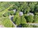 An aerial view of a home surrounded by lush greenery and trees at 9423 Fairmead Dr, Charlotte, NC 28269