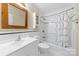 Bathroom with white tiling and modern fixtures featuring a shower/tub combo with shower curtain at 9423 Fairmead Dr, Charlotte, NC 28269