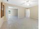 Bright bedroom with neutral carpet, a ceiling fan and an open doorway to a connected room at 9423 Fairmead Dr, Charlotte, NC 28269