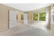 Neutral bedroom with wall to wall carpet features multiple windows with natural light at 9423 Fairmead Dr, Charlotte, NC 28269