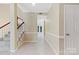 Bright foyer with stairs, neutral walls, and light floors at 9423 Fairmead Dr, Charlotte, NC 28269
