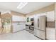 Modern kitchen with white cabinets, stainless steel appliances, and ample counter space at 9423 Fairmead Dr, Charlotte, NC 28269