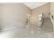 Bright, spacious living room with light-colored floors and a staircase at 9423 Fairmead Dr, Charlotte, NC 28269