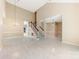 Bright, spacious living room with light-colored floors and a staircase at 9423 Fairmead Dr, Charlotte, NC 28269