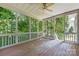 Screened-in porch overlooking a lush green yard, perfect for enjoying the outdoors at 9423 Fairmead Dr, Charlotte, NC 28269