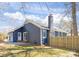 Backyard featuring newly constructed fence and patio with chimney at 9930 Sardis Oaks Rd, Charlotte, NC 28270