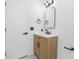 Well-lit bathroom with a modern vanity, updated fixtures, and classic arched mirror at 9930 Sardis Oaks Rd, Charlotte, NC 28270