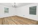 Sunlit bedroom featuring hardwood floors, and multiple windows at 9930 Sardis Oaks Rd, Charlotte, NC 28270