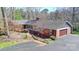 Aerial view of a brick home with mature landscaping and a driveway leading to the attached garage at 101 Woodvale Cir, Lincolnton, NC 28092