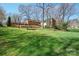 Spacious backyard with mature trees and lush green lawn at 101 Woodvale Cir, Lincolnton, NC 28092