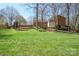 Expansive backyard with mature trees and lush green grass at 101 Woodvale Cir, Lincolnton, NC 28092