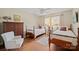 Charming bedroom with two beds, hardwood floors, and windows allowing for plenty of natural light at 101 Woodvale Cir, Lincolnton, NC 28092