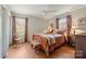 Inviting bedroom featuring wood floors, natural light, and cozy decor at 101 Woodvale Cir, Lincolnton, NC 28092