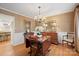 Traditional dining room with wood table, pendant lighting, and neutral wall colors at 101 Woodvale Cir, Lincolnton, NC 28092