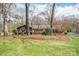 Charming brick home with a well-maintained front yard and mature trees provides great curb appeal at 101 Woodvale Cir, Lincolnton, NC 28092