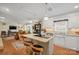 Well-lit kitchen with an island, granite countertops, stainless steel appliances, and seamless flow to the living area at 101 Woodvale Cir, Lincolnton, NC 28092