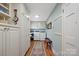 Convenient laundry room equipped with washer, dryer, and ample storage cabinets at 101 Woodvale Cir, Lincolnton, NC 28092