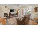 Cozy living room features a ceiling fan, wood floors, and a comfortable recliner chair at 101 Woodvale Cir, Lincolnton, NC 28092