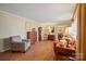Cozy living room featuring hardwood floors, a comfortable seating area, and traditional furnishings at 101 Woodvale Cir, Lincolnton, NC 28092