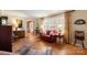 Well-lit living room with hardwood floors, comfortable seating, and a warm, inviting atmosphere at 101 Woodvale Cir, Lincolnton, NC 28092