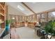 Comfortable sunroom with skylights, many windows and neutral furniture that looks out into nature at 101 Woodvale Cir, Lincolnton, NC 28092