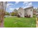 Backyard featuring a wood deck and grassy yard at 10802 Tradition View Dr, Charlotte, NC 28269