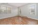Spacious bedroom with hardwood floors and lots of natural light from the multiple windows at 10802 Tradition View Dr, Charlotte, NC 28269