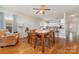 Charming dining area with hardwood floors, open to the kitchen, perfect for Gathering gatherings at 10802 Tradition View Dr, Charlotte, NC 28269