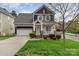 Charming two-story home with a well-manicured lawn and inviting curb appeal at 10802 Tradition View Dr, Charlotte, NC 28269