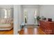 Foyer featuring hardwood floors and natural light, creating a welcoming atmosphere at 10802 Tradition View Dr, Charlotte, NC 28269